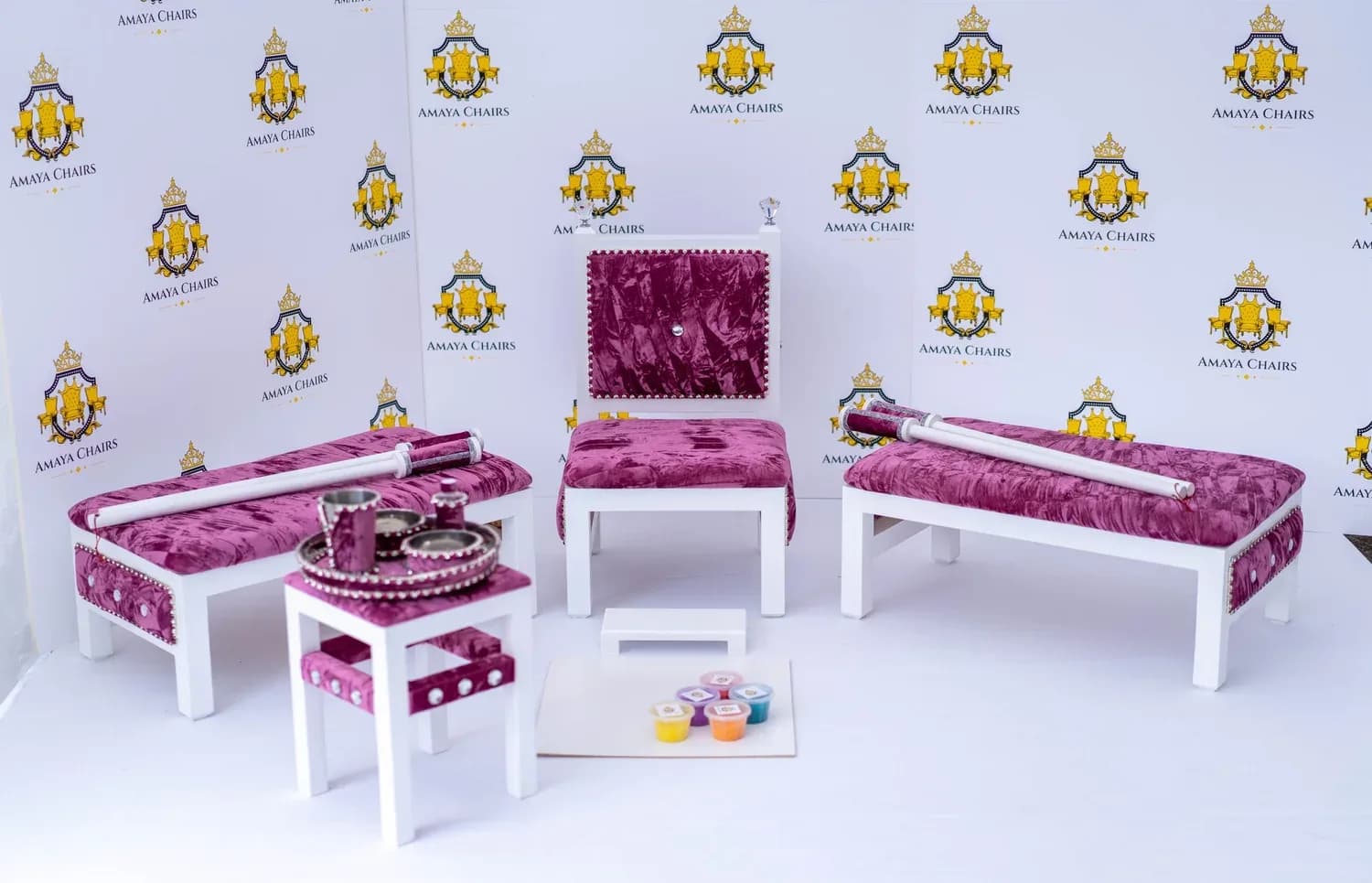 The full Rose Quartz suite photographed in the workshop: head chair, both benches, tray table and the rangoli board laid out.