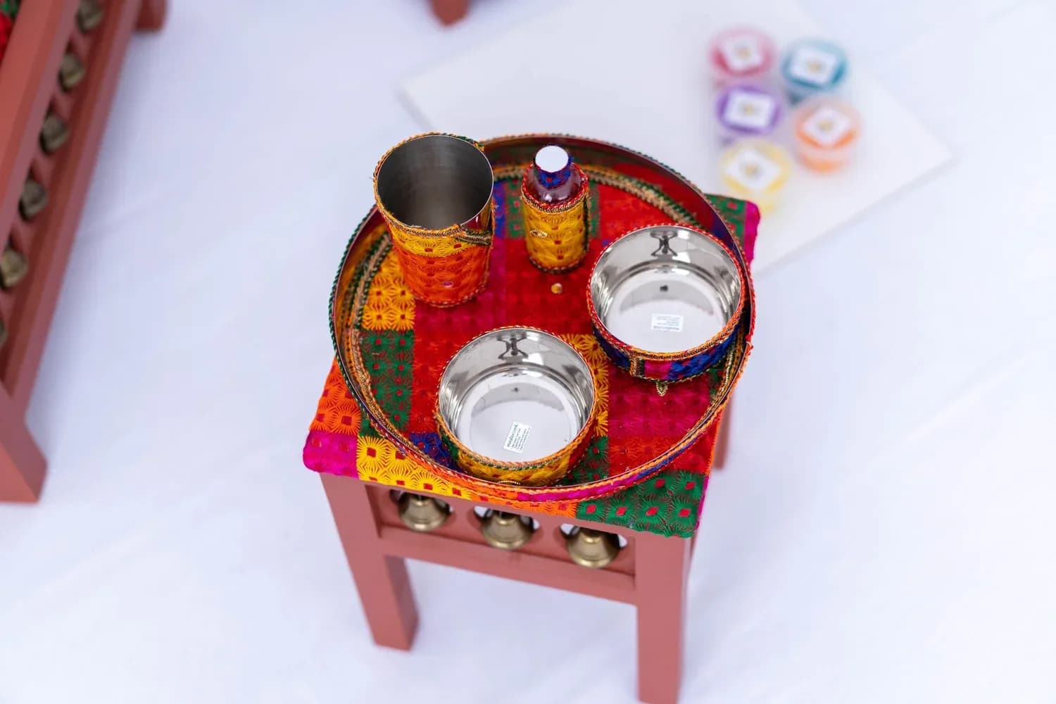 The Satrang tray table with the brass Sagan tray, bowls, cup and oil bottle.